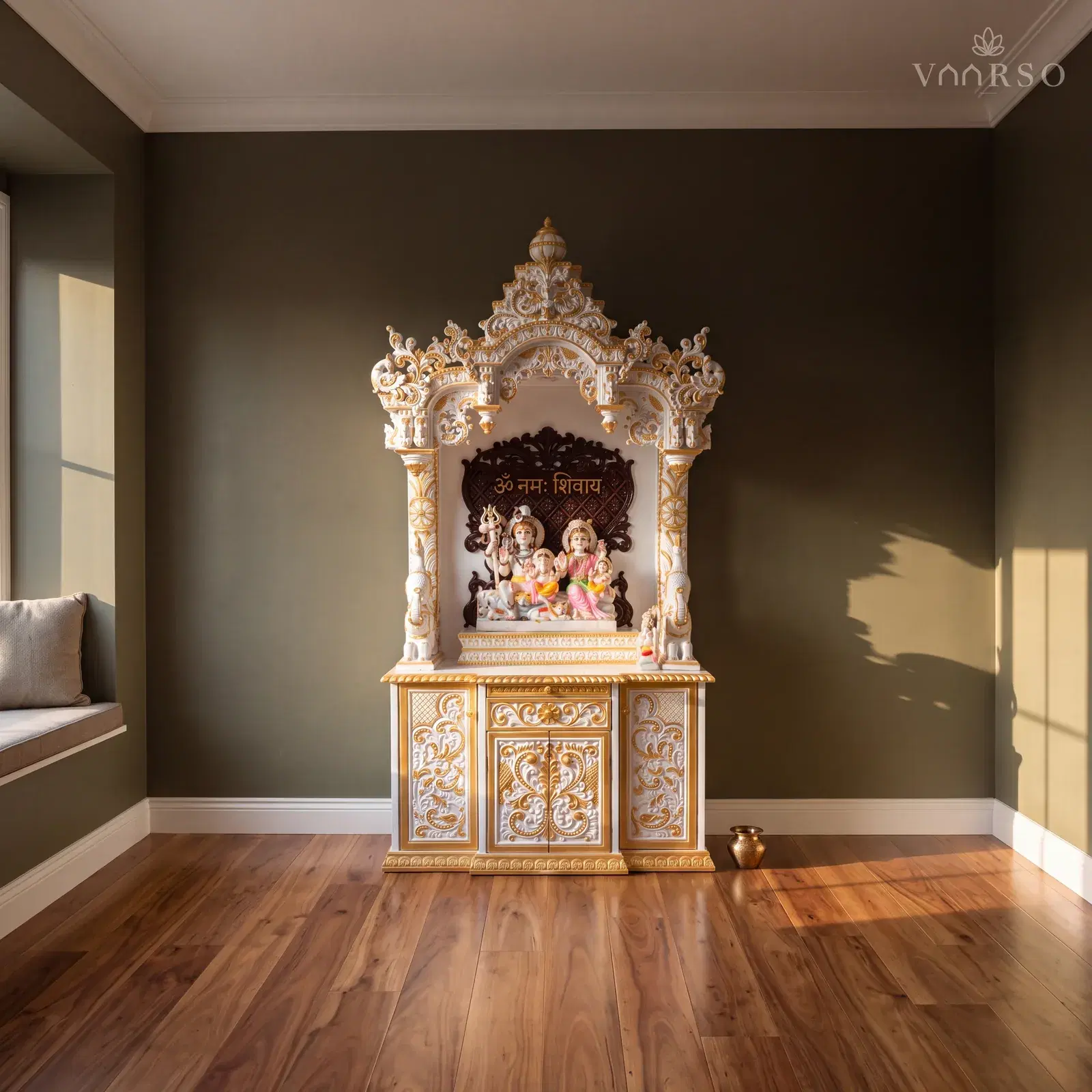 The same mandir in a small study retreat, a window seat along one side, spotted gum boards underfoot and a small brass kalash on the floor beside it
