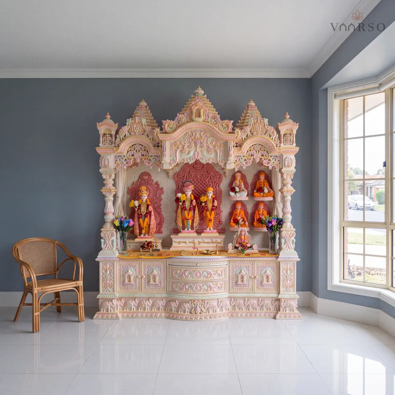 The same mandir in a formal front lounge, a bay window to the street at one side, white porcelain tile underfoot and a rattan armchair turned toward it