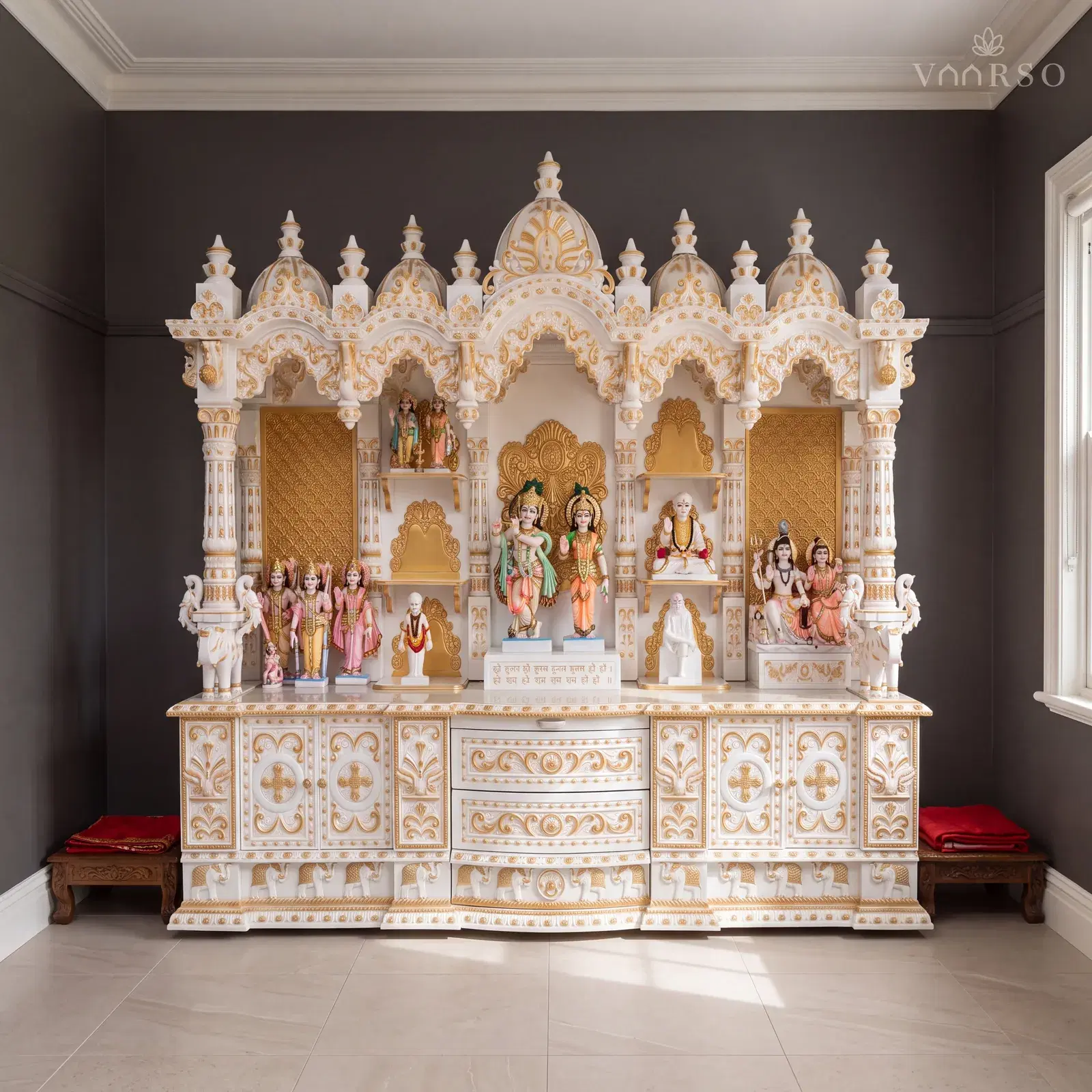 The same mandir in a Federation-era living room, a picture rail running above the crest, sand-toned porcelain tile underfoot and a low carved chowki with a folded red cloth on it