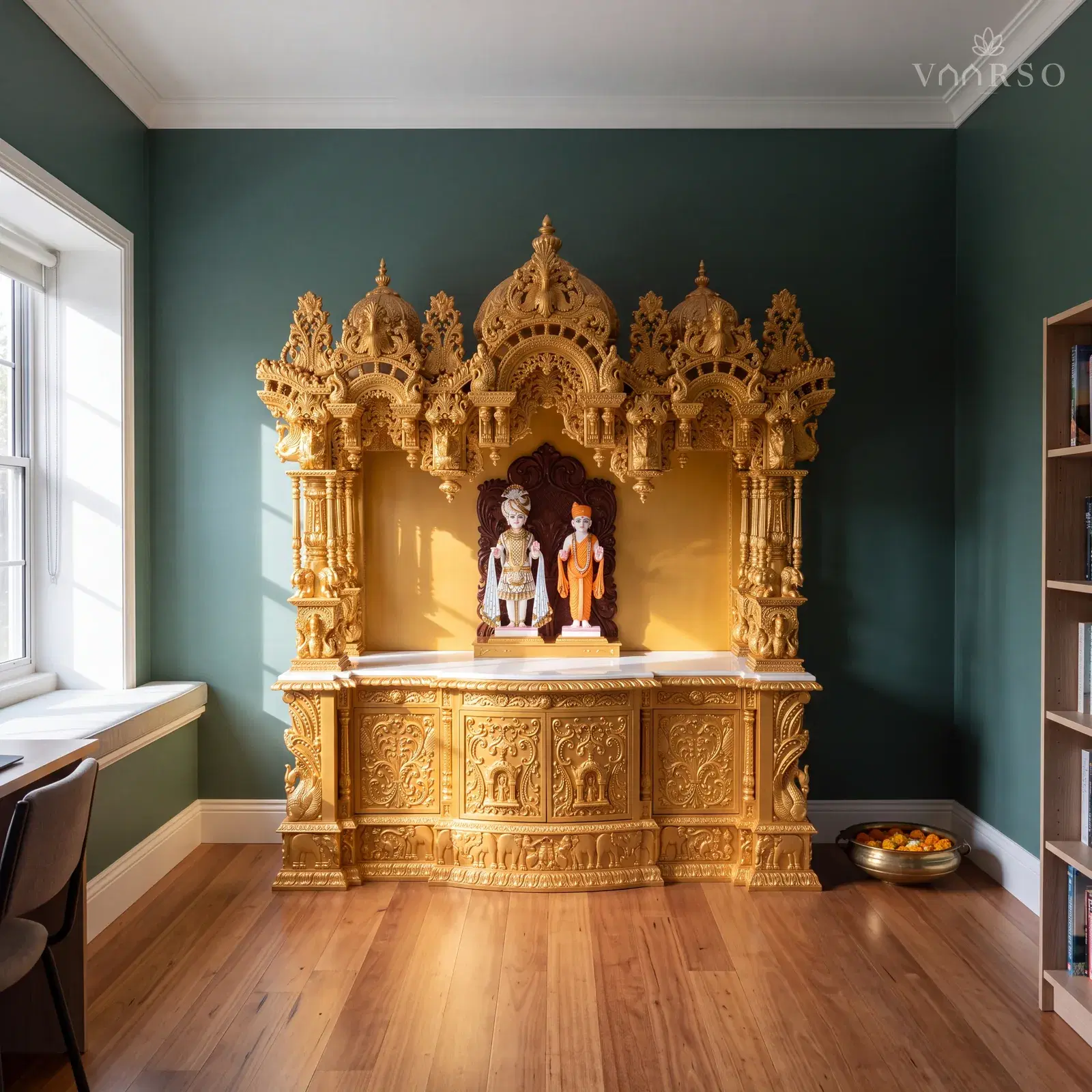 The same mandir in a small study retreat, a window seat along one side, blackbutt boards underfoot and a brass urli of floating marigolds on the floor